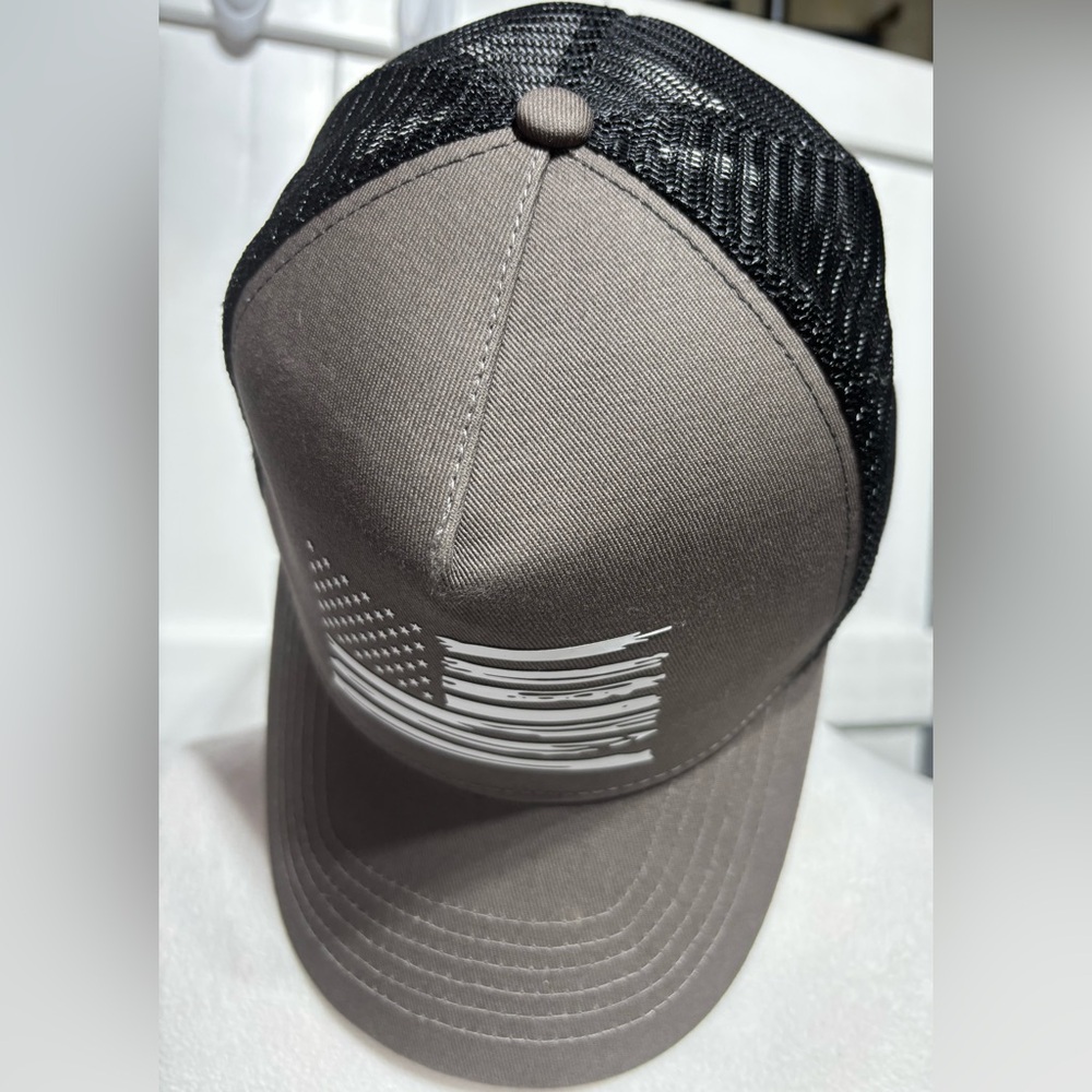 NWOT Amazon flag brown/back trucker hat